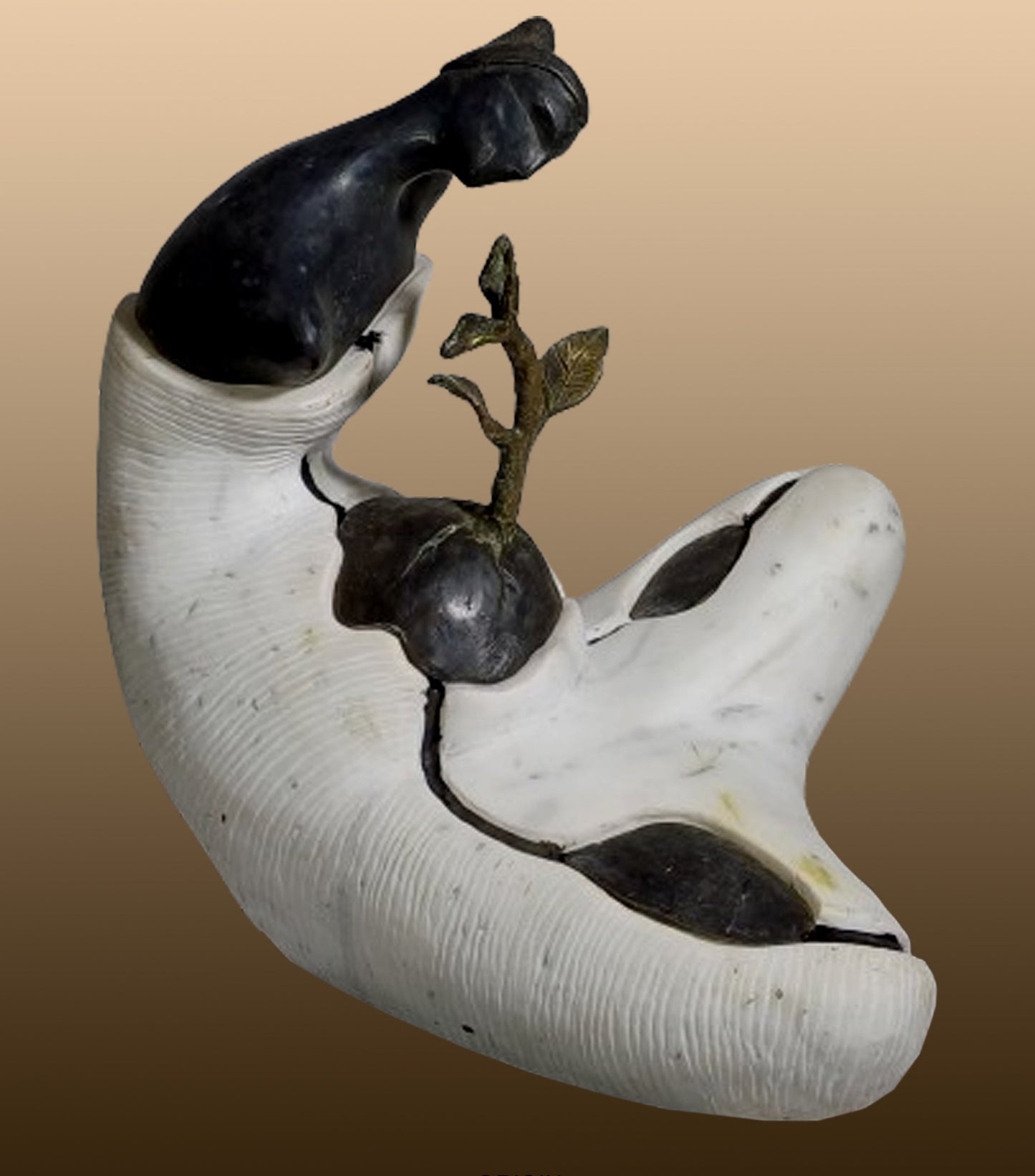 Subrata Paul contemporary fine art sculpture titled Origin showing a dark bronze figurative form nesting a green bronze plant sprout emerging from a carved white marble base