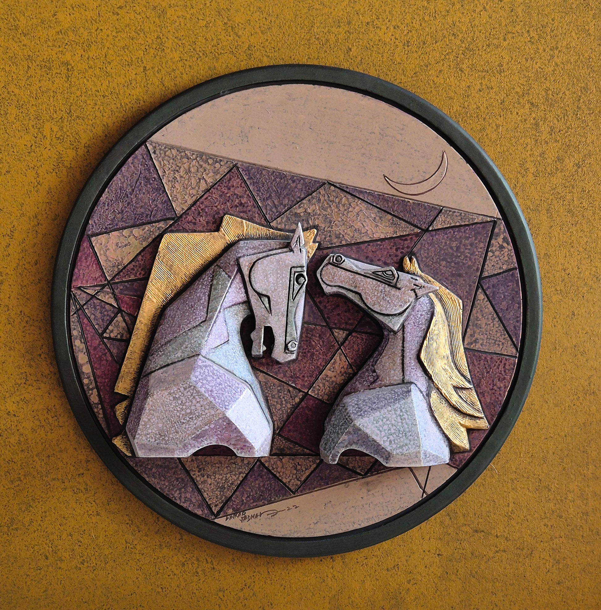 Circular wall-mounted relief sculpture titled 'Caressing' by Dinkar Jadhav, featuring two stylized, textured horses facing each other against a geometric background.