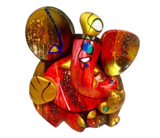 A colorful contemporary fiberglass sculpture of Lord Ganesha by Om Swami titled Agrapujyay, featuring intricate patterns in red, orange, and gold.