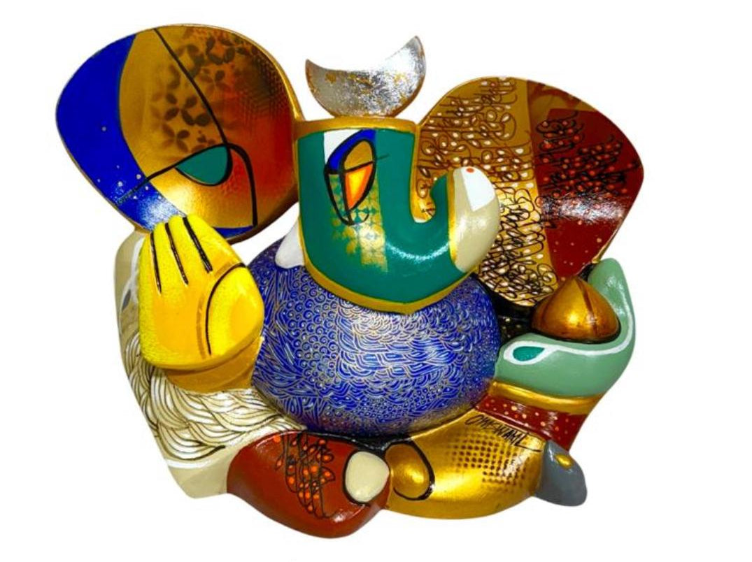 A colorful contemporary fiberglass sculpture of Lord Ganesha by Om Swami titled Gunayay, featuring intricate patterns in blue, red, and gold.