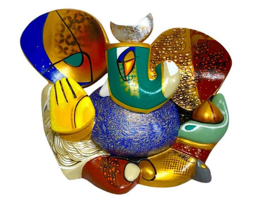 A colorful contemporary fiberglass sculpture of Lord Ganesha by Om Swami titled Gunayay, featuring intricate patterns in blue, red, and gold.